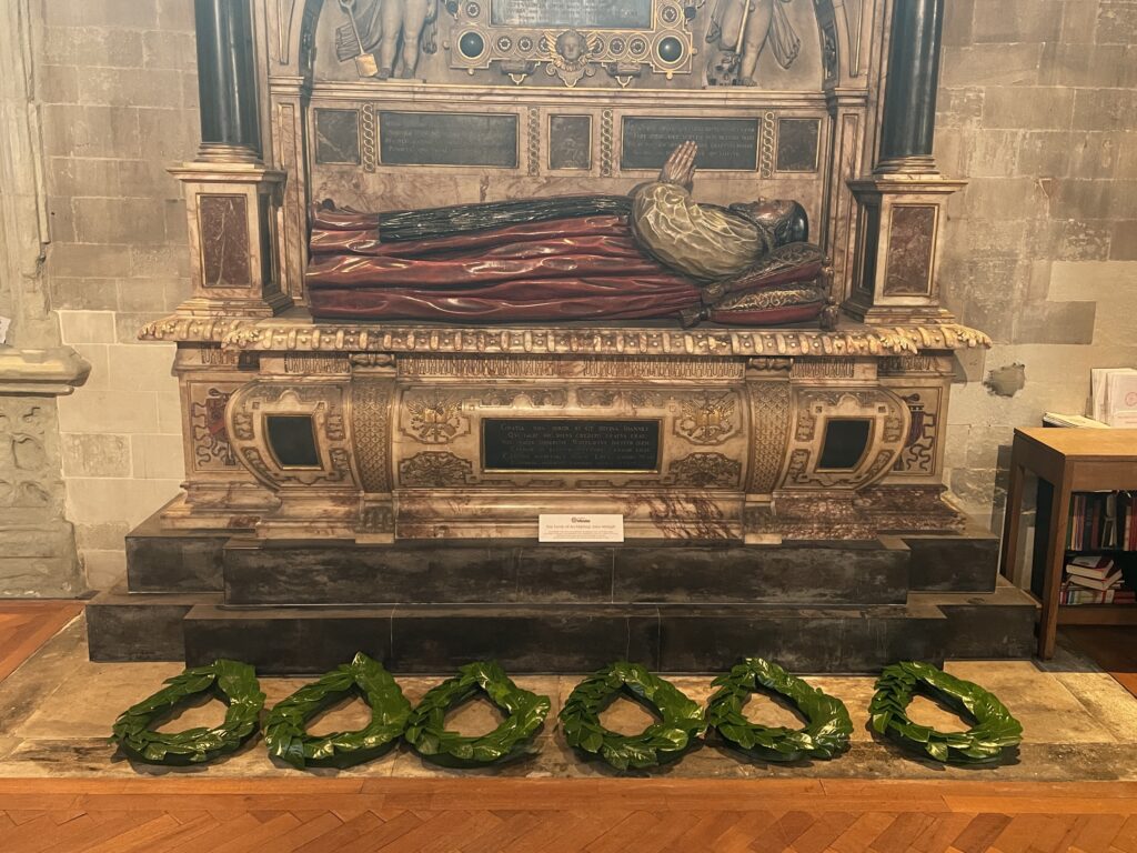 Wreaths of green leaves lay on the ground beneath the tomb of John Whitgift in Croydon Minster
