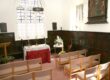 Inside the chapel, modern seating is provided but the historic pews remain