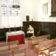 Inside the chapel, modern seating is provided but the historic pews remain