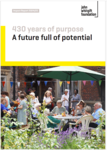 The cover of the 2024/25 Impact Report featuring a photograph of a group of people enjoying a garden party in the grounds of the Whitgift Almshouses